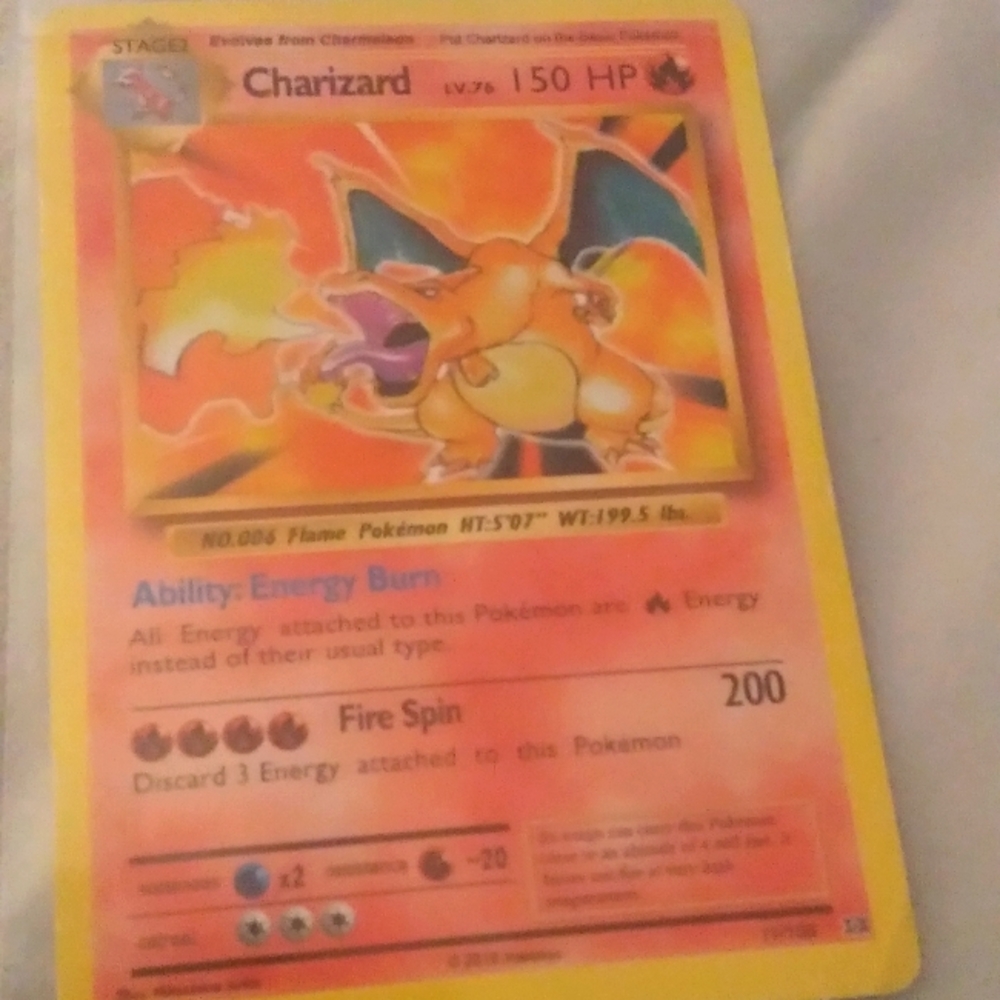 Charizard Pokémon card in protective sleeve